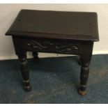 A small oak coffin stool. Est. £25 - £30.
