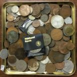 A box containing old coins. Est. £20 - £30.