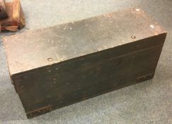 An old wooden ammunition box. Est. £20 - £30.