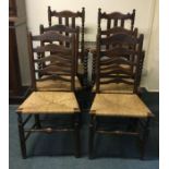 A set of six rush seated chairs. Est. £50 - £80.