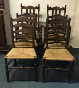 A set of six rush seated chairs. Est. £50 - £80.