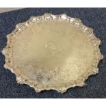 A large 18th Century silver salver with central ar