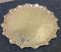A large 18th Century silver salver with central ar