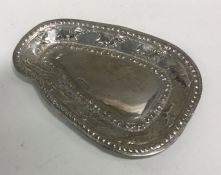 An Indian silver dish decorated with elephants. Ap