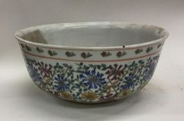 A Chinese porcelain fruit bowl decorated in bright