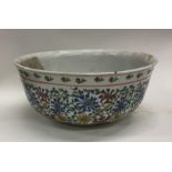 A Chinese porcelain fruit bowl decorated in bright