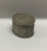 A chased silver hinged top box with shell decorati