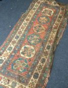 Three old rugs. Est. £40 - £60.