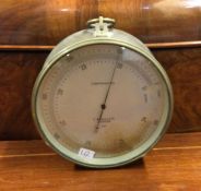 A brass mounted barometer with silvered dial. Est.
