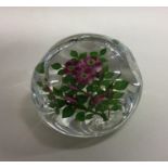 A good glass paperweight decorated with flowers in