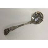 A heavy Kings' pattern silver sifter spoon. London