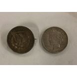 A 1922 silver Dollar together with one other conve