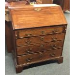 A Georgian mahogany four drawer bureau. Est. £50 -