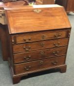 A Georgian mahogany four drawer bureau. Est. £50 -