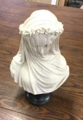 An alabaster bust of "The Veiled Virgin". Signed to base. Est. £40 - £50.