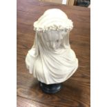 An alabaster bust of "The Veiled Virgin". Signed to base. Est. £40 - £50.