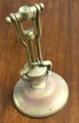 A brass mounted lamp holder. Est. £20 - £30.