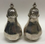 A pair of Victorian silver peppers. London 1895. A