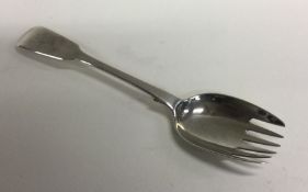 An unusual fiddle pattern silver olive fork. Londo