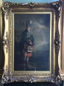 A large gilt framed picture of a Highlander in kil