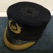 A 'GWR' station master's cap. Est. £10 - £20.