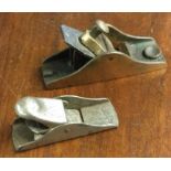 A small bronze smoothing plane etc. Est. £20 - £30