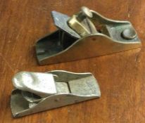 A small bronze smoothing plane etc. Est. £20 - £30