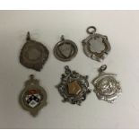 A group of six silver watch chain medallions. Est.