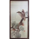 A framed and glazed silk embroidery depicting a bird of prey. Approx. 100cms x 49cms. Est. £30 - £40