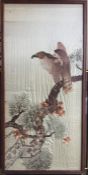 A framed and glazed silk embroidery depicting a bird of prey. Approx. 100cms x 49cms. Est. £30 - £40