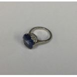 A good blue stone ring in six stone platinum claw