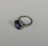 A good blue stone ring in six stone platinum claw