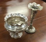 A chased Indian silver bowl together with a silver
