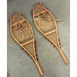 A pair of Canadian snow shoes mounted with deer fu