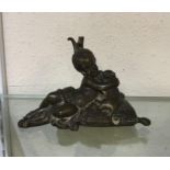 An old bronze paperweight. Est. £30 - £40.