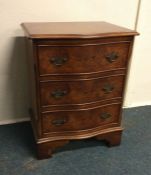 A mahogany serpentine chest of three drawers. Est.