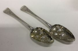 A pair of heavy George III silver berry spoons. Lo