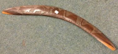 An unusual boomerang. Est. £20 - £30.