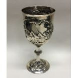 A chased Victorian silver goblet decorated with ri