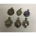 A group of six silver watch chain medallions. Est.