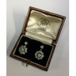 A fine pair of circular diamond cluster earrings i