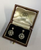 A fine pair of circular diamond cluster earrings i