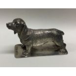 EDINBURGH: A heavy Scottish silver figure of a dog