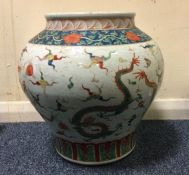A tall Chinese baluster shaped vase decorated with