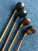 A wooden handled HICKORY golf driver by Lockwood t