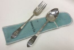 TIFFANY & CO: A silver christening knife and fork