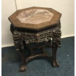 A Chinese occasional table with marble inset. Est.