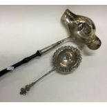 A large Georgian silver double lipped ladle togeth