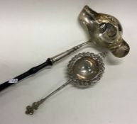 A large Georgian silver double lipped ladle togeth