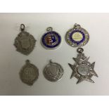 A group of six silver watch chain medallions. Est.